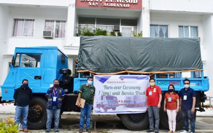 <p><strong>IMPROVED MOBILITY</strong>. Cagdianao Mining Corporation (CMC) officers led by Engr. Arnilo Milaor (3rd from left), resident mine manager, turns over a service truck to the Cagdianao municipal government represented by municipal administrator Marc Adelson Longos (3rd from right), on April 3, 2020. CMC also donated an ambulance to help the local government improve its mobility and logistics in responding to the coronavirus disease crisis. (<em>Contributed photo</em>)  </p>