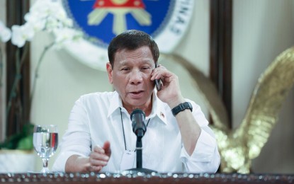 <p><strong>PEACE AND STABILITY.</strong> President Rodrigo Roa Duterte talks on the phone with Socialist Republic of Vietnam Prime Minister Nguyen Phuc at the Malago Clubhouse in Malacañang, Manila on May 26, 2020.  Duterte and Phuc reaffirmed the two countries’ shared commitment to pursue peace, security, and stability in the South China Sea. <em>(Presidential photo by Karl Norman Alonzo)</em></p>