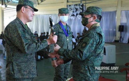 <p><strong>NEW 9ID HEAD.</strong> Philippine Army commander, Lt. Gen. Gilbert Gapay (right), leads the change-of-command ceremony of the 9th Infantry Division in Camarines Sur on Wednesday (May 27, 2020). Brig. Gen. Henry Robinson Jr. (left) assumed as the new head of the 9th Infantry Division, replacing Maj. Gen. Fernando Trinidad (center) who mandatorily retired from the service. <em>(Photo courtesy of Army Chief Public Affairs Office)</em></p>