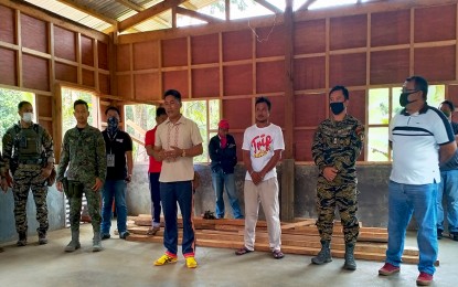 <p><strong>SCHOOL FOR IP CHILDREN.</strong> Indigenous people leaders in Lianga, Surigao del Sur, led by Jawudon Jumar Bucales (center) express gratitude to the government for the progress of the construction of a tribal school in Sitio Simuwao, Barangay Diatagon. The tribal leaders, along with local and military officials, inspect the ongoing construction of the school on Wednesday (May 27, 2020). <em>(Photo courtesy of 3SFBn)</em></p>