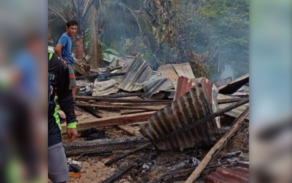 <p><strong>BURNED DOWN.</strong> Residents check on to the debris of their houses in Zone 2, Barangay Limonda, Opol town, Misamis Oriental on Thursday, looking for materials to salvage. Ten armed men believed to be communist New People's Army combatants attacked the community in a predawn raid Thursday. <em>(Photo courtesy of Opol Municipal Police Station)</em></p>