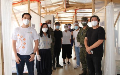 <p><strong>PATIENT CARE CENTER.</strong> Military officials, private sector partners, and Quezon City Mayor Joy Belmonte (2nd from left) lead the turnover of an emergency quarantine facility (EQF) to the Rosario Maclang Bautista General Hospital in Batasan Road, Quezon City on Friday (May 29, 2020). The AFP and its partners also turned over another EQF to the Novaliches District Hospital. <em>(Photo courtesy of AFP Public Affairs Office)</em></p>