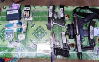 <p><strong>SEIZED</strong>. The drug paraphernalia and firearms recovered from slain drug suspects Mashud Usop and Suharto Tuas during a drug buy-bust operation along Rosales Extension, Rosary Heights 6, Cotabato City on Saturday (May 30, 2020). Five other suspects, believed to be street-level drug peddlers, were arrested in the same operation. <em>(Photo courtesy of PDEA-BARMM)</em></p>
<p> </p>