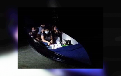 <p><strong>INTERCEPTED.</strong> Seven undocumented Filipinos aboard a motorboat from Sandakan, Sabah, Malaysia. Troops of the Marine Battalion Landing Team-6 intercept them as they were about to dock late Sunday (May 31, 2020) at the shore of Barangay Poblacion, Turtle Islands town, Tawi-Tawi. <em>(Photo courtesy of MBLT-6)</em></p>