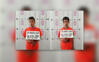 <p><strong>ARRESTED.</strong> Two suspected New People's Army (NPA) rebels were arrested in a law enforcement operation Saturday (May 30, 2020) in Barangay Delucot, Godod municipality, Zamboanga del Norte. The two allegedly belong to the NPA's Front Committee Feliciano A. <em>(Photo courtesy of Police Regional Office-9)</em></p>