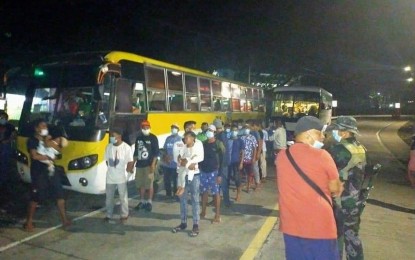 <p><strong>AID FOR SACADAS.</strong> Sugar migrants arrive in Antique pass by a checkpoint in the municipality of Hamtic in this photo taken in May. More than 300 of them will receive Aid to Individuals in Crisis Situation (AICS) from June 4 and 5. <em>(Photo courtesy of Antique PDRRMO)</em></p>