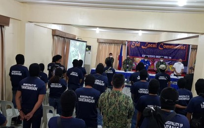 <p><strong>RETURNEES</strong>. Some of the 32 New People’s Army (NPA) combatants formally surrender to authorities and local officials in Tantangan town, South Cotabato on Tuesday (June 2, 2020). The former rebels, who were previously under the Guerilla Front 73 (Musa) of the NPA - Far South Mindanao Region, voluntarily yielded 20 firearms, explosives, and subversive materials. (<em>Photo courtesy of the provincial government of South Cotabato</em>) </p>