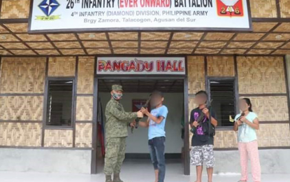 <p><strong>LOCAL SUPPORT.</strong> Lt. Col. Romeo C. Jimenea (left), commander of the Army's 26th Infantry Battalion, receives the three NPA surrenderers at the 26IB headquarters in Talacogon town, Agusan del Sur Monday (June 1, 2020). The Army official lauds the support of the local Task Force to End Local Communist Armed Conflict for facilitating the surrender of communist rebels in the area. <em>(Photo courtesy of 26IB)</em></p>