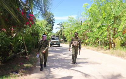 <p><strong>SAFEGUARDING COMMUNITIES.</strong> Soldiers of the Army’s 19th Infantry Battalion patrol the upland town of Arakan in North Cotabato on Wednesday. The military in the area says the coronavirus disease crisis has dealt a blow on New People's Army, resulting in the mass surrender of its members in the past several months. <em>(Photo courtesy of 19IB)</em></p>