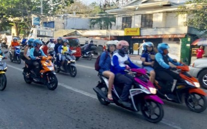 <p><strong>BACK RIDING ALLOWED IN CEBU.</strong> The mayors in 44 towns and six component cities in the Province of Cebu commended the decision of Governor Gwendolyn Garcia on Wednesday (June 3, 2020) to allow motorcycle back-riding to answer the clamor of the public due to lack of public transportation during the general community quarantine. However, ride-hailing app Angkas and “habal-habal” as modes of transportation for a fee are still not allowed.<em> (PNA photo by John Rey Saavedra)</em></p>