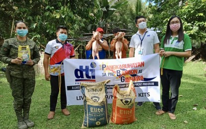 <p><strong>LIVELIHOOD FOR EX-REBELS</strong>. Two of the 24 former New People's Army rebels in Bohol hold the piglets they received as part of the PHP240,000 Negosyo Kits from the Department of Trade and Industry (DTI)-Bohol. First Lieutenant Elma Grace Remonde said on Monday (June 8, 2020) that the distribution of the Negosyo Kits was part of the strengthened programs of the National Task Force to End Local Armed Conflict (NTF-ELCAC) and DTI-Bohol's commitment under the Enhanced Comprehensive Local Integration Program or ECLIP for former rebels. <em>(Photo courtesy of 47th Infantry Battalion-Civil Military Operations)</em></p>