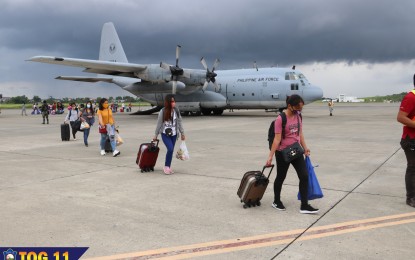 <p><strong>BACK HOME.</strong> A total of 27 locally stranded individuals disembark from a C-130 plane of the Philippine Air Force (PAF) at the Davao International Airport on Sunday (June 7, 2020). On the same day, the PAF also airlifted 19 LSIs via a C-295 medium transport aircraft to the Zamboanga International Airport.<em> (Photo courtesy of Air Force TOG 11)</em></p>