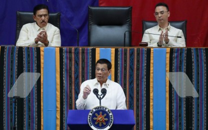 <p><strong>SONA</strong>. President Rodrigo Duterte delivers his 4th State of the Nation Address (SONA) at the House of Representatives in Quezon City on July 22, 2019. Malacañang on Wednesday (July 22, 2020) said Duterte will deliver his 5th SONA in a chamber separate from guests to lessen the risk of exposure to coronavirus at the Batasang Pambansa on July 27. <em>(Presidential photo by Simeon Celi Jr.)</em></p>