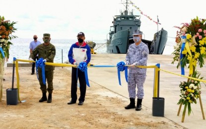<p><strong>UPGRADING FACILITIES.</strong> Defense Secretary Delfin Lorenzana (center) and several military officials lead the inauguration of the beaching ramp at the Pag-asa Island on June 9, 2020. In a pre-SONA forum on Wednesday (July 22, 2020), Lorenzana said these upgrades of facilities in the Kalayaan Group of Islands are aimed at improving the living conditions of Filipino troops and civilians deployed and living in these islands. <em>(File photo)</em></p>