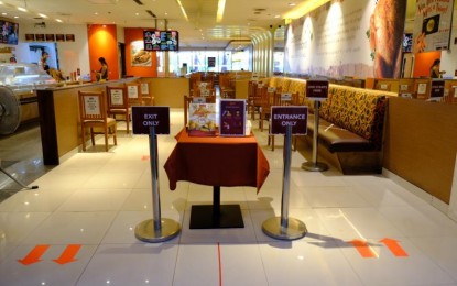<p><strong>READY FOR 'NEW NORMAL'.</strong> A restaurant inside a mall in Manila has placed floor markers indicating one-way entrance and exit points inside the establishment. The maximum seating capacity at restaurants has been reduced to 50 percent under the "new normal". <em>(Photo courtesy of NTF vs. Covid-19)</em></p>