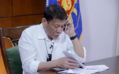 <p><strong>PHONE CONVERSATION.</strong> President Rodrigo Roa Duterte talks on the phone with Indian Prime Minister Narendra Modi at the Presidential Guest House in Panacan, Davao City on June 9, 2020. The two leaders reaffirmed their shared commitment to harness international and bilateral cooperation to effectively address the coronavirus pandemic. <em>(Presidential photo by Arman Baylon)</em></p>