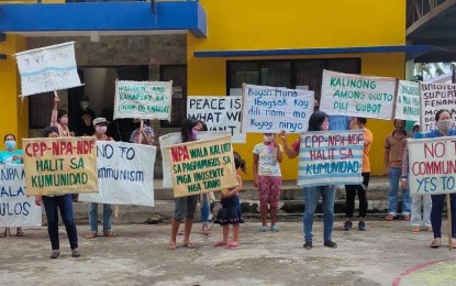 <p><strong>CALL FOR PEACE.</strong> Residents of Barangay Canlandog in Murcia, Negros Occidental hold a peace rally on Friday to show their condemnation of the atrocities and illegal activities of the Communist Party of the Philippines-New People’s Army-National Democratic Front. Four other villages in the province also conducted similar activities to mark the 122nd Philippine Independence Day. <em>(Photo courtesy of 79th Infantry Battalion, Philippine Army)</em></p>