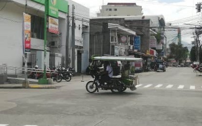 <p><strong>'TIGIL PASADA'</strong>. A motorcab-for-hire is seen plying a street in Dumaguete City in a file photo. Some drivers and operators of 'pedicabs' ended their brief transport strike on Monday (June 15, 2020) after Mayor Felipe Antonio Remollo and the Highway Patrol Group agreed to allow them to carry two passengers per unit instead of one as announced last week. <em>(PNA file photo by Judy Flores Partlow)</em></p>
