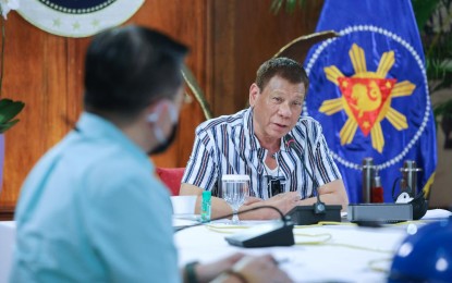 <p><strong>ECONOMIC RECOVERY</strong>. President Rodrigo R. Duterte holds a meeting with members of the Inter-Agency Task Force on the Emerging Infectious Diseases (IATF-EID) at the Malago Clubhouse in Malacañang on June 15, 2020. Duterte would meet with the business community to ensure the early recovery of the Philippine economy from the impact of the coronavirus disease 2019 (Covid-19). <em>(Presidential photo by Robinson Niñal Jr.)</em></p>
