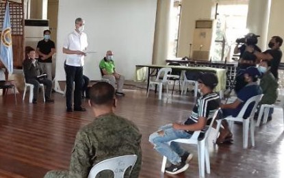 <p><strong>ASSISTANCE TO FORMER REBELS</strong>. Negros Occidental Governor Eugenio Jose Lacson (standing) leads the turn-over of immediate assistance of PHP15,000 each to two former rebels from the sixth district of the province. The ceremony, held at the Capitol Social Hall in Bacolod City on Wednesday (June 17, 2020), was witnessed by officials of the Department of the Interior and Local Government, military, and police. <em>(Photo courtesy of 79th Infantry Battalion, Philippine Army)</em></p>
<p> </p>