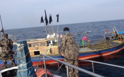 <p><strong>DETAINED</strong>. Indonesian patrol boat detains a foreign fishing boat for illegal fishing activities. <em>(ANTARA/HO-KKP)</em></p>