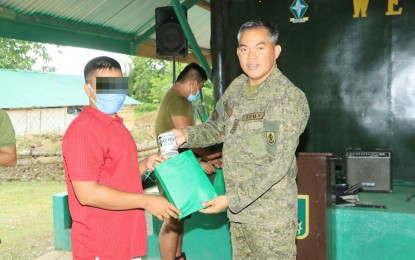 <p><strong>DESTROYING FAMILIES.</strong> Lt. Col. Julius Cesar Paulo (right), commander of the Army's 23rd Infantry Battalion, criticizes the communist New People’s Army for disregarding the value of family among their members. Paulo led the celebration of Father’s Day on Sunday (June 21, 2020) with Army troopers and former rebels at their headquarters in Barangay Alubijid, Buenavista, Agusan del Norte. <em>(Photo courtesy of 23IB)</em></p>