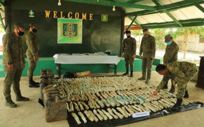 <p><strong>RECOVERED WAR MATERIEL.</strong> Lt. Col. Julius Cesar C. Paulo (3rd from right), commander of the Army's 23rd Infantry Battalion, and 1Lt. Roel T. Maglalang (right), civil-military operations officer, check the seized materials for the production of anti-personnel mines and improvised explosive devices belonging to the communist New People’s Army on Tuesday (June 23, 2020). The war materiel were recovered in a hinterland village in Esperanza municipality, Agusan del Sur. <em>(Photo courtesy of 23IB)</em></p>