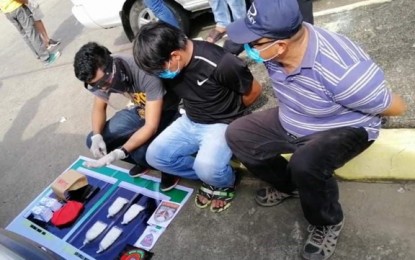 <p><strong>ARRESTED.</strong> Agents of the Philippine Drug Enforcement Agency, backed by policemen, have arrested two suspects in a buy-bust Wednesday (June 24, 2020). Authorities recovered some PHP3.4 million worth of suspected shabu in Pagadian City, Zamboanga del Sur. <em>(PNA photo by Leah D. Agonoy)</em></p>