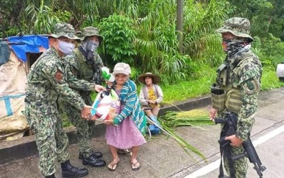 <p><br /><strong>‘KAPWA KO, SAGOT KO’</strong>. A senior citizen in San Rafael village Taft, Eastern Samar receives a pack of relief goods from the Eastern Samar Provincial Mobile Force Company (ESPMFC) on June 15, 2020. The Philippine National Police in the region on Wednesday (June 24, 2020) said they already assisted 16,516 indigent families affected by the health crisis through its “Kapwa ko, Sagot Ko!” adopt-a-family program. <em>(Photo courtesy of ESPMFC)</em></p>