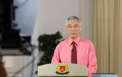 <p><strong>ADDRESS TO THE NATION.</strong> Singapore Prime Minister Lee Hsien Loong speaks during a live address to the nation in Singapore on Tuesday (June 23, 2020). Singapore Prime Minister Lee Hsien Loong said he has advised President Halimah Yacob to dissolve the parliament and issue the Writ of Election. <em>(Ministry of Communications and Information of Singapore/Handout via Xinhua)</em></p>