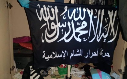 <p><strong>TERRORISTS KILLED.</strong> An ISIS flag is among the paraphernalia recovered from an anti-terror operation in Parañaque City on Friday (June 26, 2020). Killed in the shootout were four members of the ISIS-inspired Daulah Islamiyah terror group who is behind the bombing of the Jolo Cathedral in Sulu in January 2019. <em>(Photo courtesy of NCRPO)</em></p>