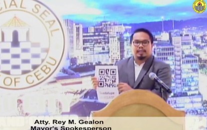 <p><strong>QR-CODED PASSES.</strong> Lawyer Rey Gealon, the spokesperson of Mayor Edgardo Labella, presents the new QR-coded quarantine pass during a briefing at the Cebu City Hall on Friday (June 26, 2020). Gealon said each quarantine pass will be unique to every holder as it bears personal information such as name, sitio, and barangay of the bearer with a QR code that can be scanned by the mobile phones of policemen manning checkpoints. <em>(Screengrab from Cebu City Hall PIO video)</em></p>