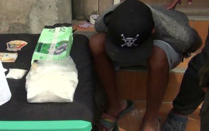<p><strong>ARRESTED.</strong> Authorities in Zamboanga City nab a teenager (seated in baseball cap) in an anti-drug operation Saturday (June 27, 2020) in Barangay Sta. Barbara. The 17-year-old suspect yielded a kilo of shabu with an estimated market value of PHP6.8 million, authorities say. <em>(Photo courtesy of Zamboanga City Police Station 10)</em></p>