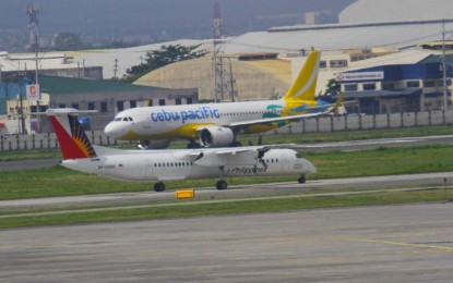 <p>Passenger planes at NAIA <em>(File photo)</em></p>