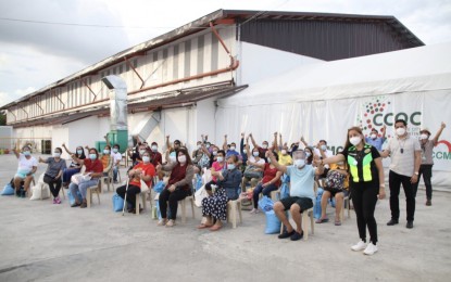 <p><strong>RECOVERED</strong>. Forty-two Covid-19 patients are in jubilant mood after receiving the good news that they have recovered while in isolation at the Cebu City Quarantine Center in the North Reclamation Area on July 3, 2020. The Department of Health (DOH) in Central Visayas reported that 63 percent of active Covid-19 cases in Cebu City are either asymptomatic and staying at home, or with mild to moderate symptoms spending their isolation period at the barangay-run centers. <em>(Photo courtesy of Cebu City Hall PIO)</em></p>