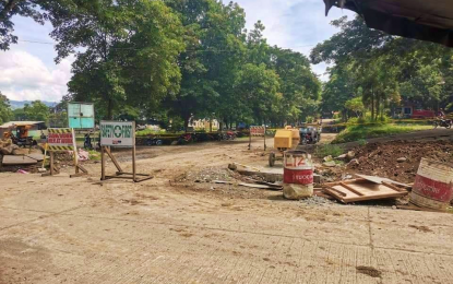 <p><strong>GRENADE FOUND.</strong> The site where a fragmentation grenade was found by a tricycle driver beside a yellow cement mixer in the road undergoing repairs some 15 meters from the entrance of the municipal gymnasium of Alamada, North Cotabato on Wednesday (July 8, 2020). Police investigators say the explosive was not meant to disrupt the Social Amelioration Program cash dispersal as its safety pin remained intact. <em>(Photo courtesy of Alamada MPS)</em></p>