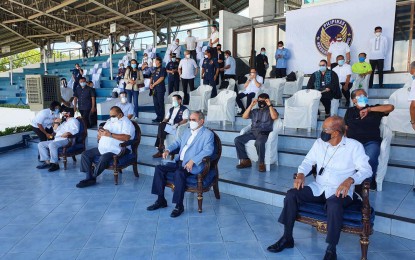 <p><strong>FINAL RESPECTS.</strong> Cabinet officials attend the ceremony for the arrival of the remains of 49 OFWs from Saudi Arabia at the Villamor Airbase in Pasay City on Friday (July 10, 2020). The Department of Labor and Employment assured that all 274 bodies of deceased OFWs in the kingdom would be repatriated to the Philippines. <em>(Photo courtesy of DOLE)</em></p>