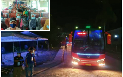 <p><strong>SAFE ARRIVAL</strong>. The buses that carried the 499 locally stranded individuals (LSIs) from the Bangsamoro Autonomous Region in Muslim Mindanao (BARMM) arrive from Cagayan de Oro City at the isolation facility of the Sanitarium Hospital in Sultan Kudarat, Maguindanao late Thursday (July 9, 2020). The LSIs (Inset) will be sent to their respective provinces after testing negative from coronavirus disease rapid testing while those who will turn out positive will stay behind to complete the mandatory 14-day quarantine.<em> (Photo by BARMM Interior Minister Naguib Sinarimbo)</em></p>