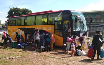 <p><strong>HOMEBOUND</strong>. Returning residents of South Cotabato prepare to board a bus bound for the province after arriving on Wednesday morning (July 8, 2020) at the provincial capitol grounds in Isulan town, Sultan Kudarat following a three-day travel from the Quirino Grandstand in Manila. The passengers were beneficiaries of the national government’s Hatid Tulong program. (<em>Photo courtesy of the provincial government of South Cotabato</em>) </p>