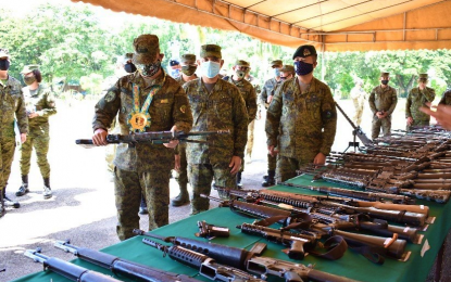 <p><strong>CAMP VISIT</strong>. Armed Forces of the Philippines Chief of Staff Felimon Santos Jr., during a visit to the Army’s 6th Infantry Division (ID) in Maguindanao on Friday (July 10, 2020), inspects a rifle recovered by the 6ID from recent combat operations against enemies of the state in its area of operation. Behind him are 6ID commander Maj. Gen. Diosdado Carreon and Western Mindanao Command chief Lt. Gen. Cirilito Sobejana. <em>(Photo courtesy of 6ID)</em></p>