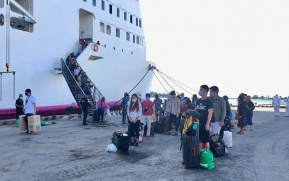 <p><strong>HOME IN CARAGA.</strong> At least  817 locally stranded individuals arrived at the Nasipit Port in Agusan del Norte Sunday afternoon (July 12). Upon arrival in their respective provinces, the LSIs will undergo 14-day quarantine as part of the health protocol to contain the spread of the coronavirus disease 2019.<em> (Photo courtesy of Freida Judith Milan of PEZA)</em></p>