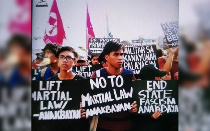 <p><strong>DREAM SHATTERED.</strong> Therese Fuentes' son, Frances Ern (middle) in one of the rallies organized by militant group Anakbayan. Fuentes urged the group to return Frances and stop the recruitment of young people. <em>(Photo courtesy of Mrs. Therese Fuentes)</em></p>
