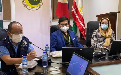 <p><strong>MORE POSITIVE CASES.</strong> Bangsamoro Autonomous Region in Muslim Mindanao Interior Minister Naguib Sinarimbo (center) announced in a press conference on Monday night (July 13, 2020) that 79 out of 405 locally-stranded individuals who came from Manila tested positive for coronavirus disease 2019. He said 148 other LSIs are still awaiting the results of their tests. <em>(Photo courtesy of Albashir Saiden)</em></p>