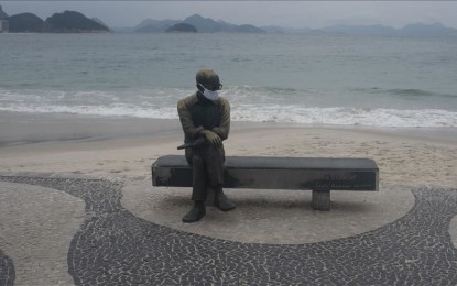 <p>A person sits on a bench at Ipanema beach, in Rio De Janeiro on June 4, 2020. <em>(Fabio Teixeira - Anadolu)</em></p>