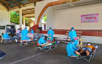 <p><strong>BLOODLETTING</strong>. Philippine Red Cross (PRC) volunteers collect blood from donors in San Ricardo, Southern Leyte Tuesday. The PRC Southern Leyte chapter on Wednesday (July 15, 2020) said a total of 1,242 units of donated blood has served some 717 patients from March to June amid the global health crisis. <em>(Photo courtesy of Jonas Maco)</em></p>