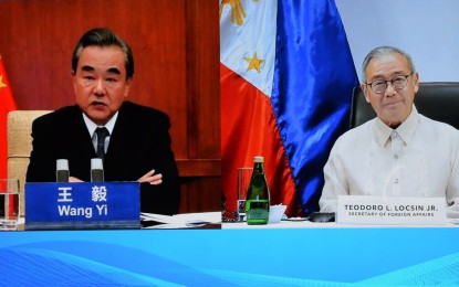 <p>Foreign Affairs Secretary Teodoro L. Locsin, Jr. (right) and Chinese State Councilor and Foreign Minister Wang Yi meet virtually to discuss Philippines-China relations on July 14, 2020. <em>(DFA photo)</em></p>