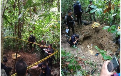 <p><strong>EXHUMED.</strong> Members of the Scene of the Crime Operation (SOCO) of the Bohol Provincial Police Office check the exhumed body of a member of the New People's Army (NPA) identified as "Ka Willy". The body was dug up after another NPA fighter captured in an encounter in Sevilla, Bohol last month revealed to the 47th Infantry Battalion and the Philippine National Police the burial site. <em>(Photo courtesy of 47th IB CMO)</em></p>