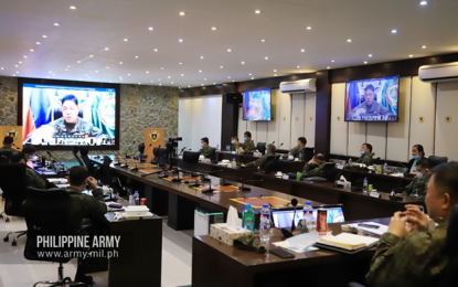 <p><strong>VIRTUAL MEETING.</strong> Army chief, Lt. Gen. Gilbert Gapay (in screen) leads the virtual command conference of Army officials in Fort Bonifacio, Taguig City on Thursday (July 16, 2020). The command conference discussed measures to achieve operational and organizational excellence, pursue the Army modernization program, and work closely with partners and stakeholders. <em>(Photo courtesy of the Army Chief Public Affairs Office)</em></p>