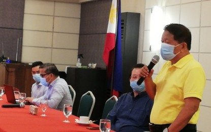 <p><strong>SEALED</strong>. Bacolod City Water District (Baciwa) chairman Lorendo Dilag (right) announces the signing of the 25-year joint venture agreement between Baciwa and PrimeWater Infrastructure Corp. that would bring in PHP6.3 billion in investments from the Villar-owned utility firm in the next 25 years, during a press conference held at the O Hotel in Bacolod City on Friday afternoon (July 17, 2020). With him are Baciwa vice chairman Lawrence Villanueva (2nd from right), PrimeWater vice president Romeo Sabater (2nd from left), and corporate counsel Gilbert Galvez (left).<em> (PNA photo by Nanette L. Guadalquiver)</em></p>