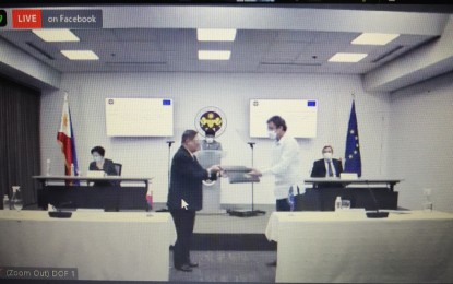 <p><strong>GRANT FOR MINDANAO DEV’T.</strong> Finance Secretary Carlos Dominguez III (left) and EU Delegation to the Philippines Chargé d'Affaires Thomas Wiersing exchange documents on Friday (July 17, 2020) for the EU's PHP3.4-billion grant for Mindanao's development. The EU extended PHP2 billion for the Mindanao Peace and Development Program - Rise Mindanao (Minpad - Rise Mindanao) and PHP1.4 billion for the Support to Bangsamoro Transition Program.<em> (Photo by Joann S. Villanueva)</em></p>
<p> </p>